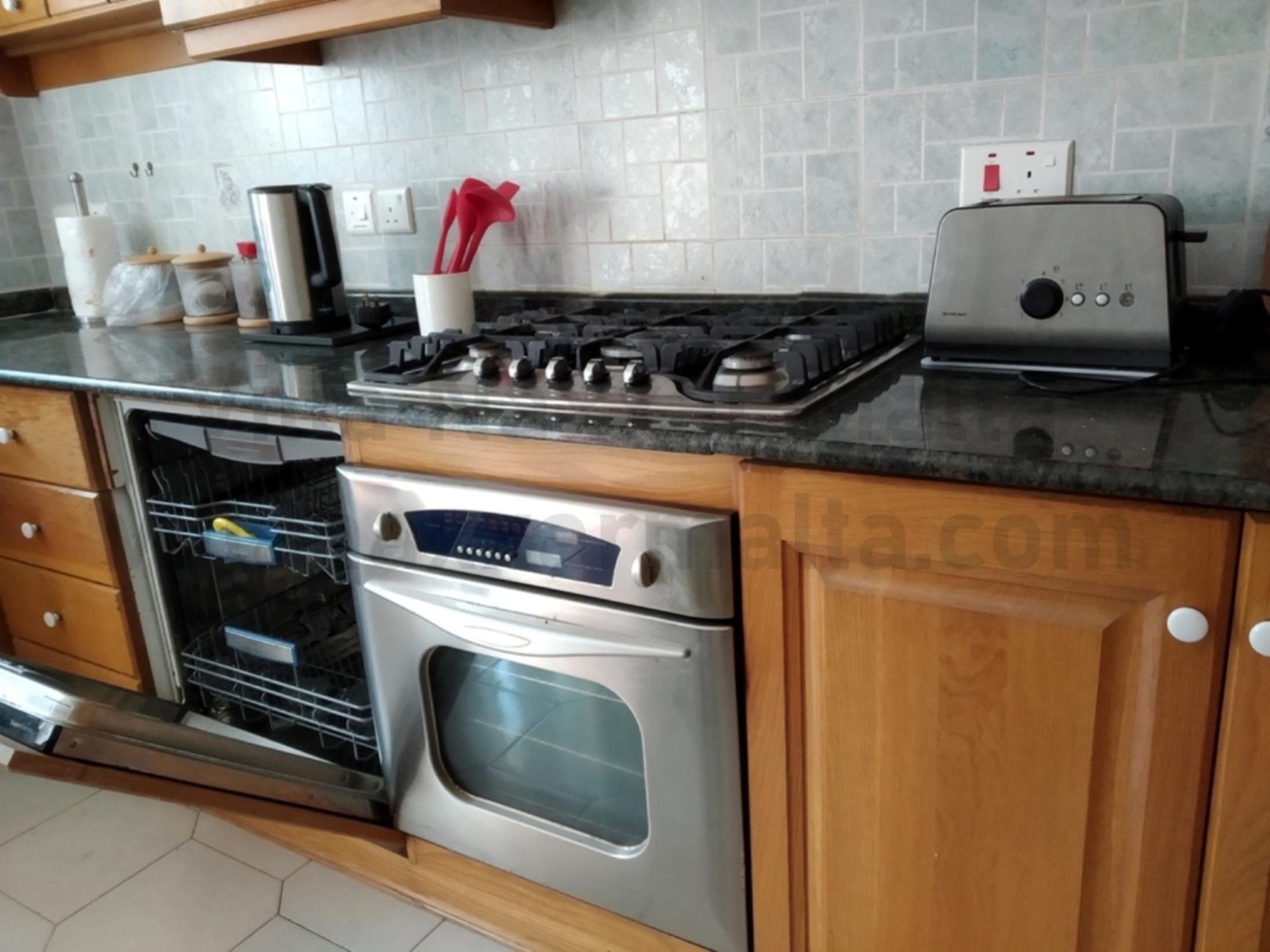 Villa Naxxar Malta – Kitchen, Dining and Living including oven/stove, microwave, dishwasher together with all the required cooking essentials, AC, WIFI and more