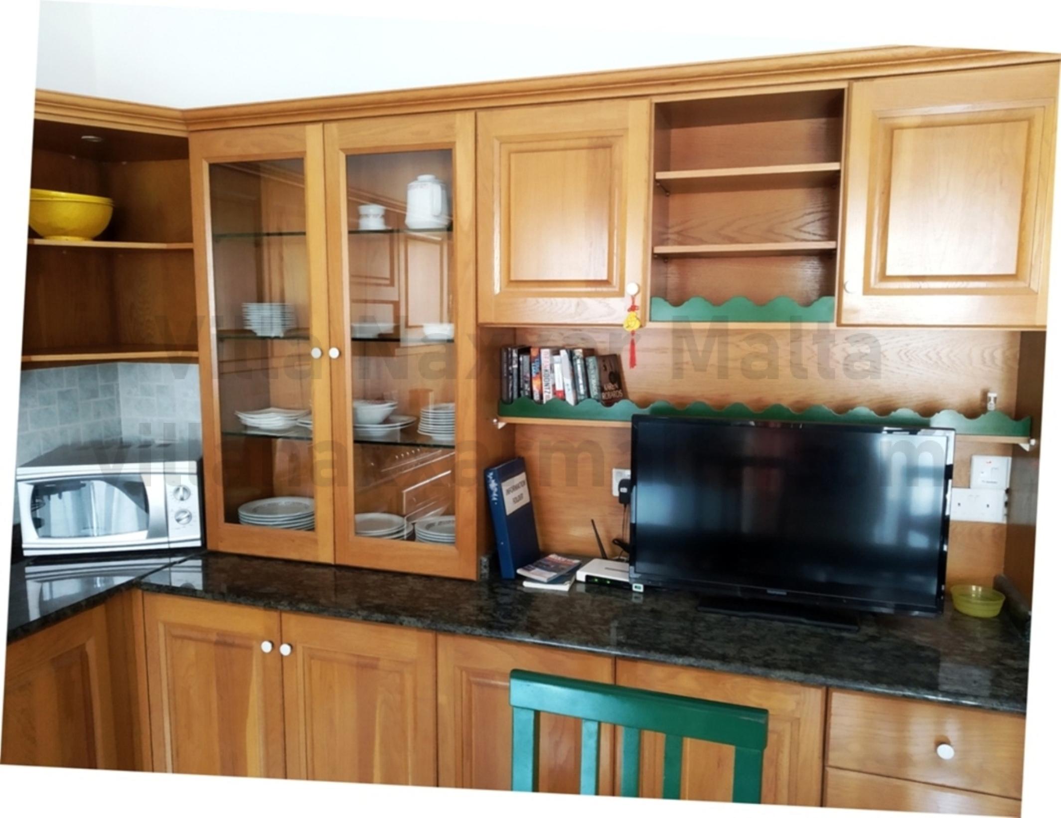 Villa Naxxar Malta – Kitchen, Dining and Living including oven/stove, microwave, dishwasher together with all the required cooking essentials, AC, WIFI and more
